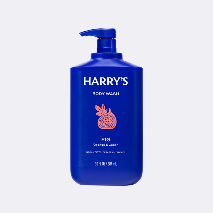 Blue bottle of Harry's body wash with a pump on a light gray background